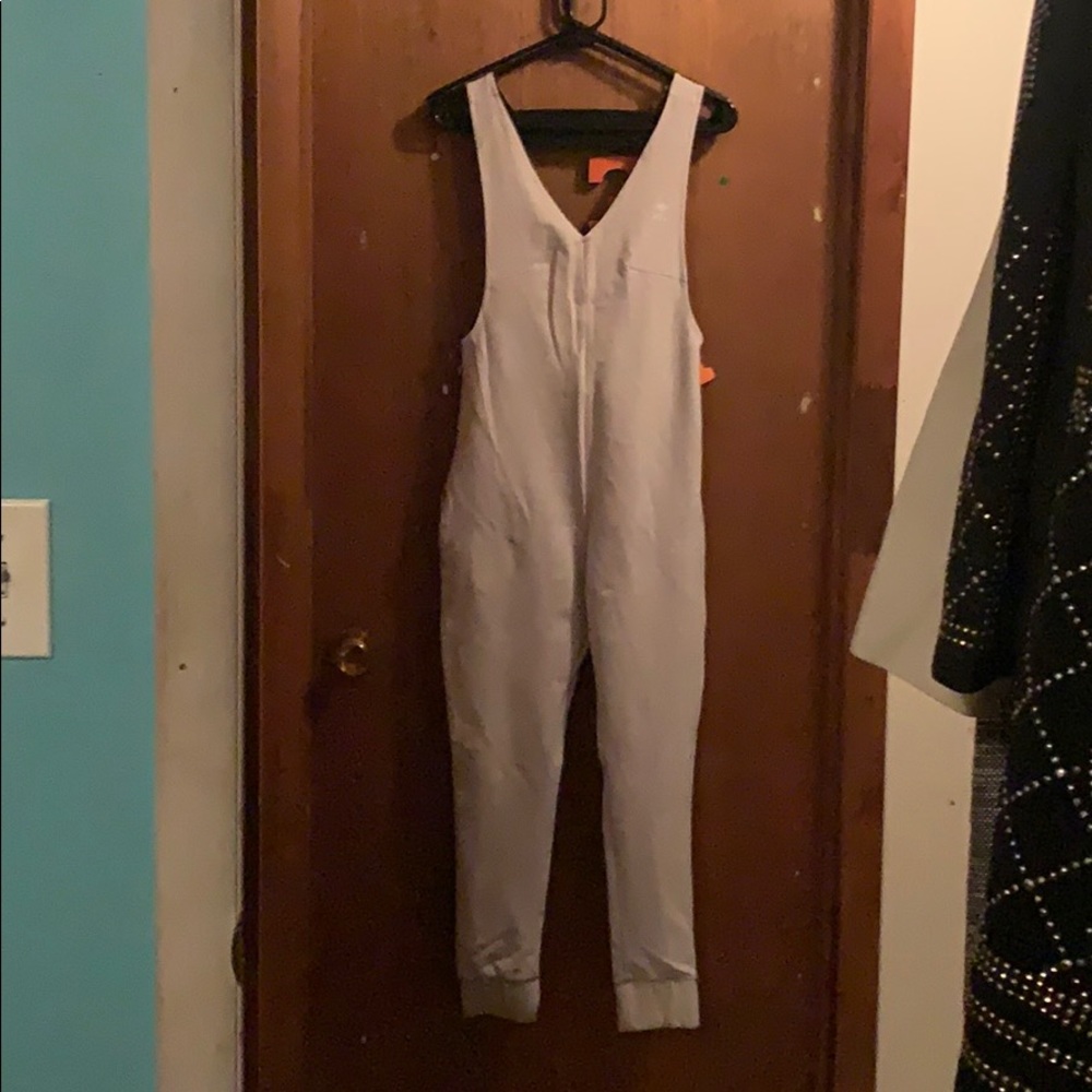 Onepiece jumpsuit. Size XS. Light grey color!